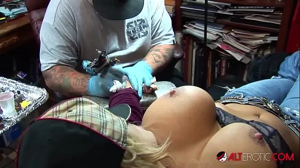 Big Busty blonde pornstar pulls out her huge tits while getting a tattoo on her wrist best Videos